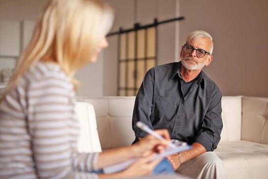 Behavioral health provider meeting with a client in session