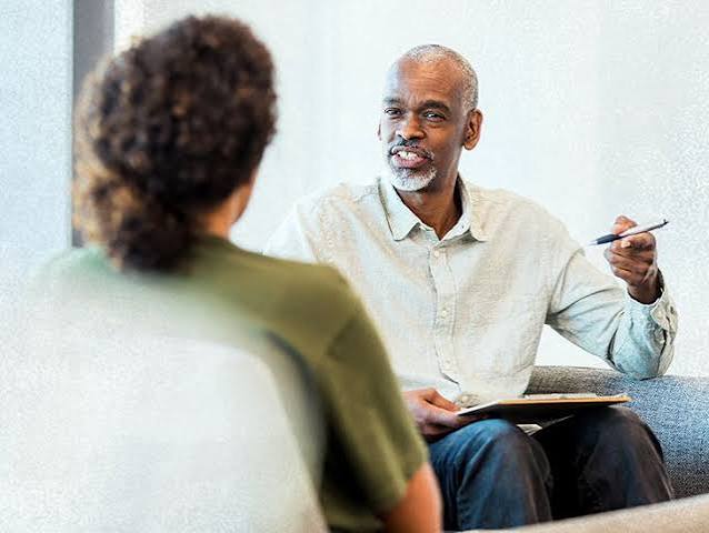 Psychiatrist discussing medication management with a patient